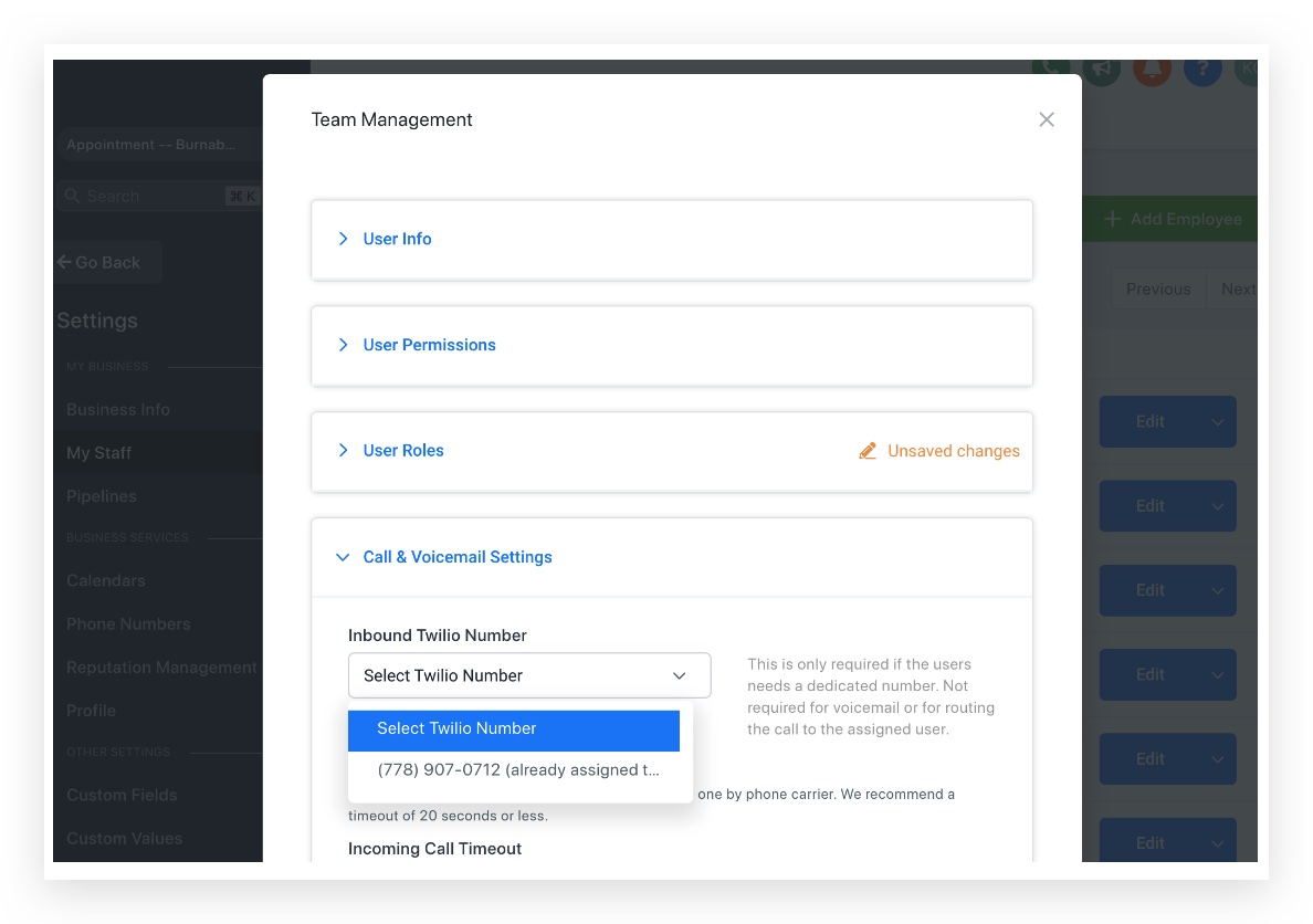 Screenshot displaying a phone number marked as 'already assigned to another user' in GoHighLevel's Call & Voicemail Settings.